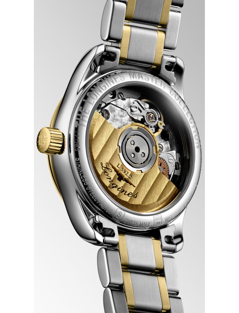 Close-up of a two-tone stainless steel and gold watch band with a transparent case back revealing the gold rotor and mechanical movement, Longines Master Collection.