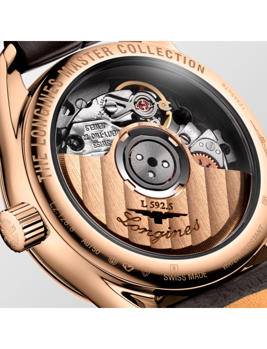Rose-gold watch back showing the intricate mechanical movement with engravings and the Longines logo visible on the rotor edge.