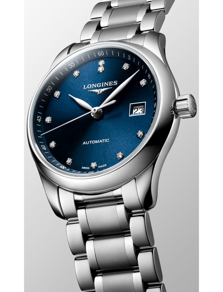 Longines automatic wristwatch with a blue dial, diamond hour markers, and a date window at 3 o'clock on a polished stainless steel bracelet.