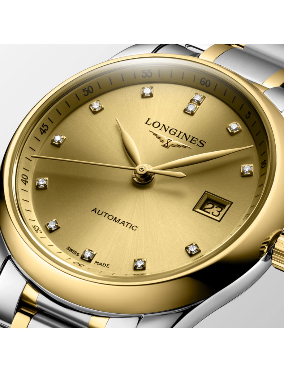 Gold Longines automatic wristwatch with diamond hour markers and a two-tone bezel and bracelet, showing date.