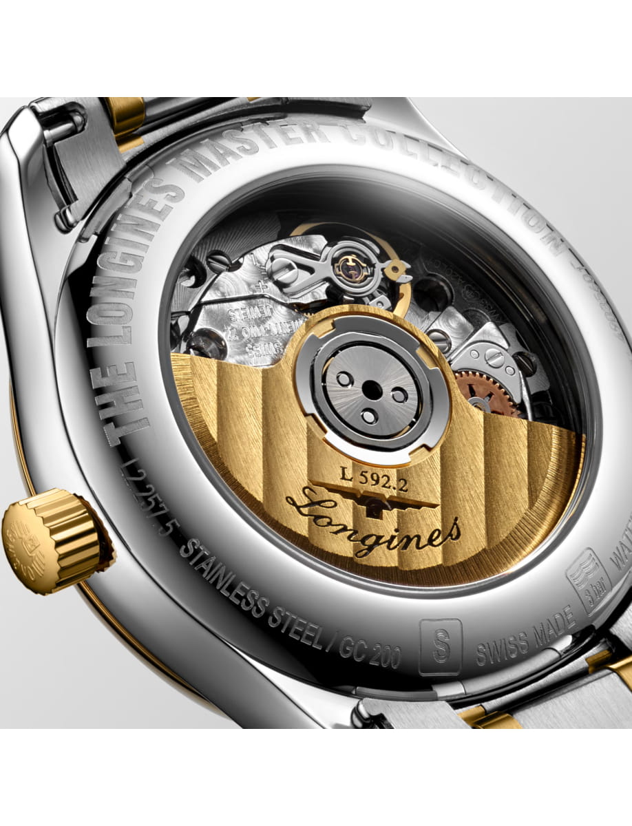 Close-up of a Longines watch movement with a gold rotor and visible gears through the case back.