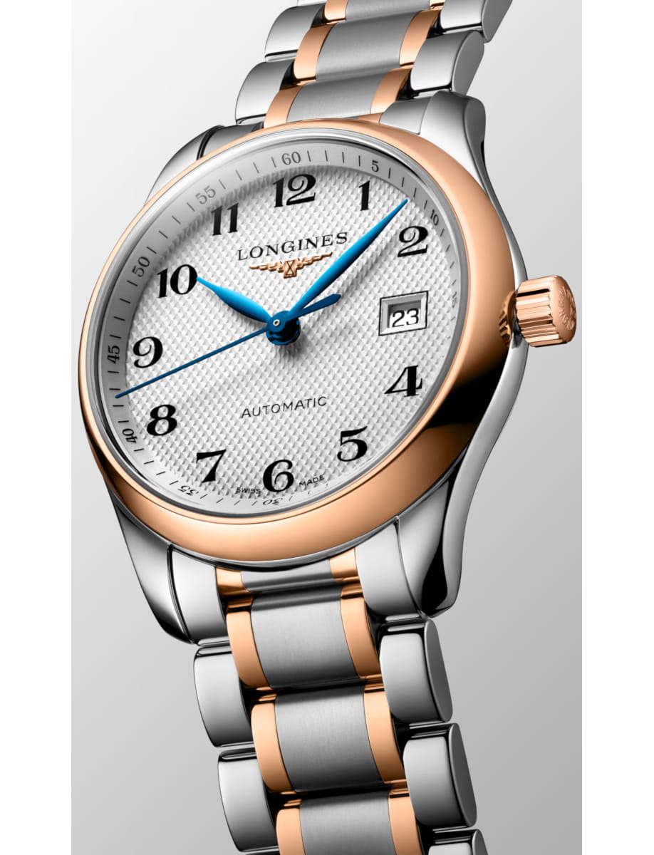 Two-tone (silver and rose gold) Longines wristwatch with a white textured dial, blue hands, and a date window showing 23.
