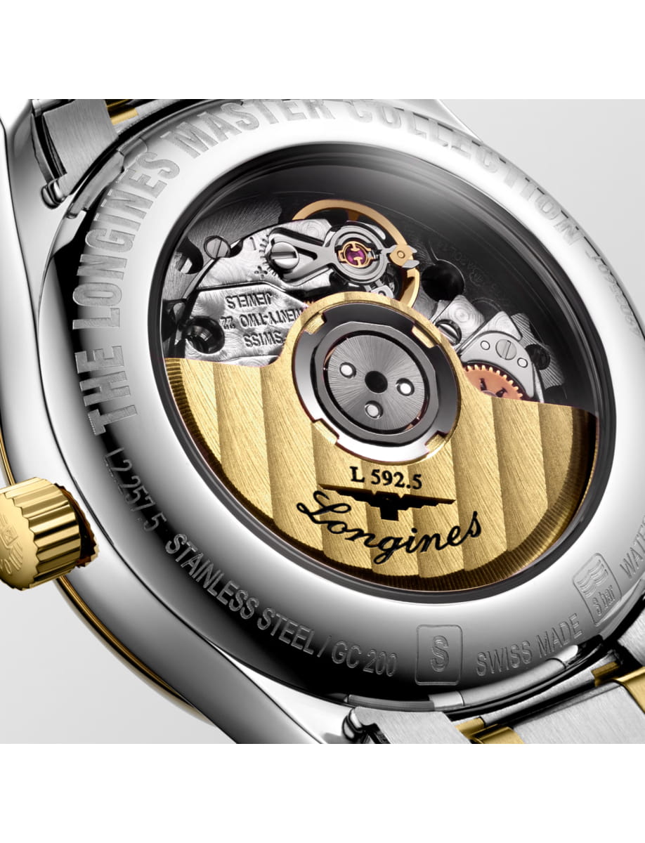 Back of a Longines wristwatch showing the intricate mechanical movement through a transparent caseback; Longines engraving around the edge and gold rotor visible.