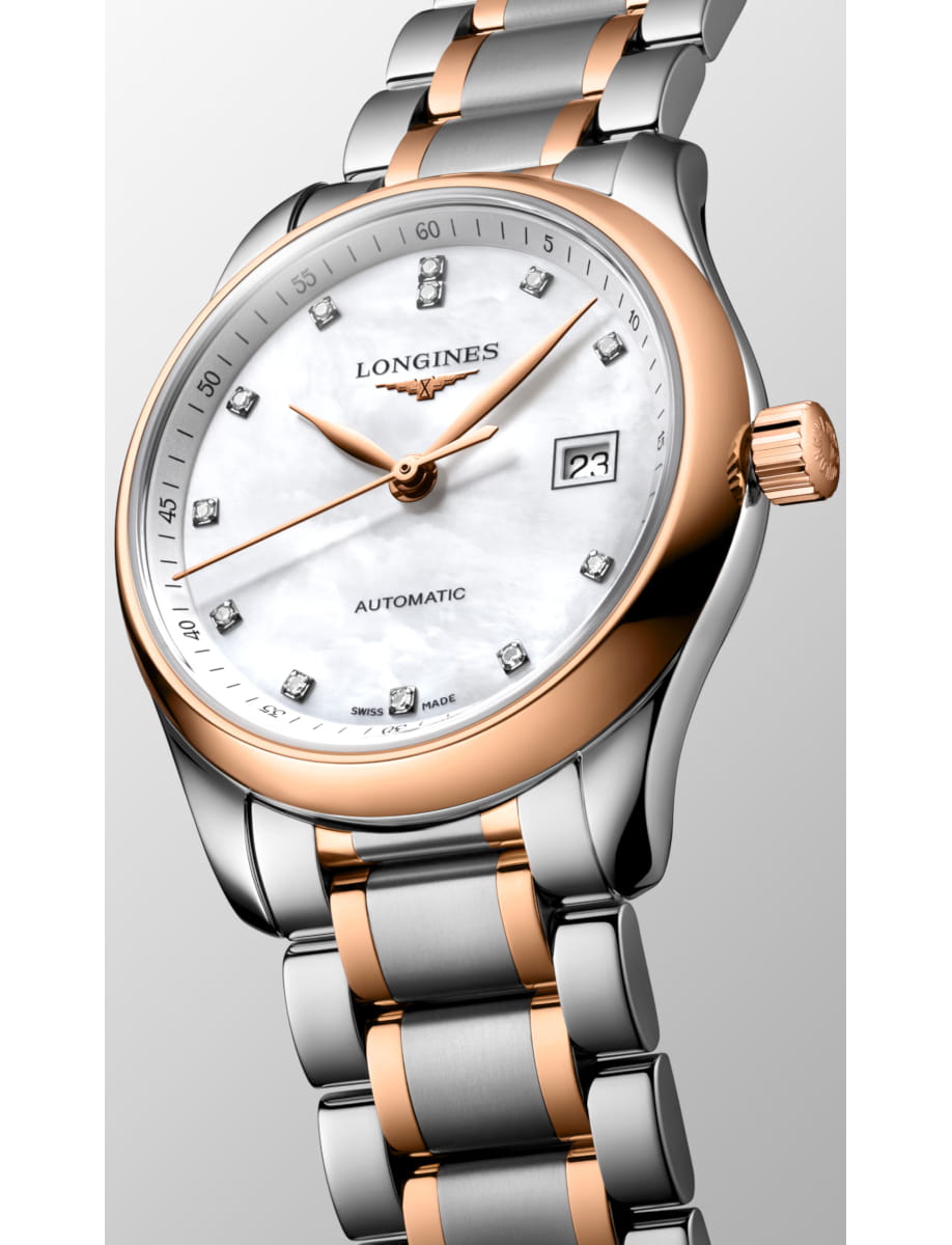 Close-up of a two-tone Longines automatic wristwatch with a rose-gold bezel, silver and rose links, and a date display.