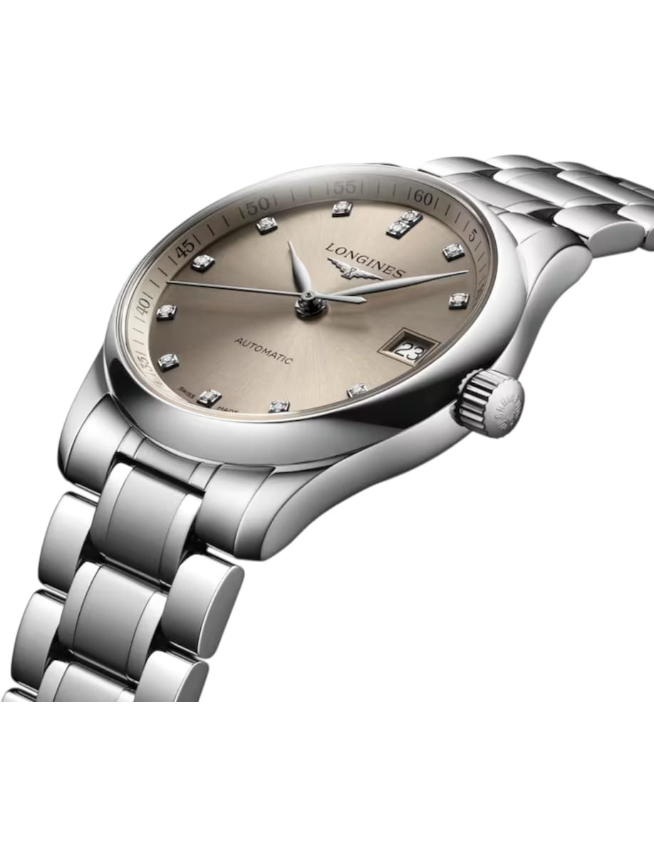 Longines automatic silver wristwatch with champagne dial, diamond hour markers, and date window at 3 o'clock.