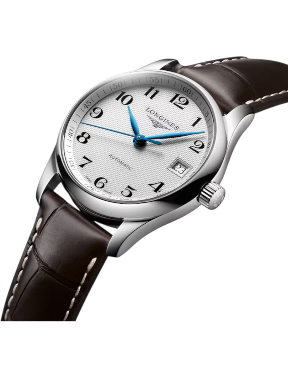 Longines wristwatch with a white textured dial, blue hands, and a brown leather strap with white stitching