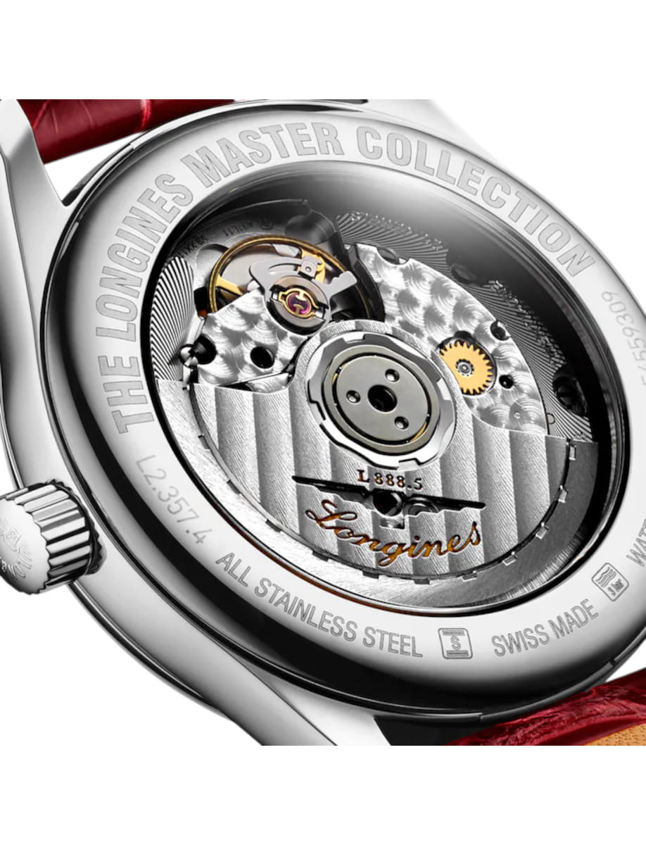 Close-up of a Longines Master Collection watch back, showing the intricate mechanical movement and engravings around the case.
