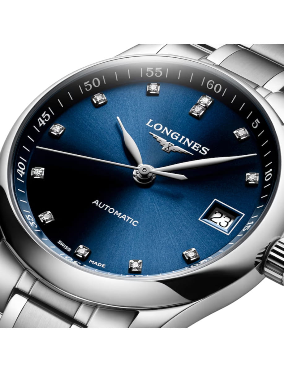 Longines automatic wristwatch with a blue sunburst dial, diamond hour markers, and a date window at 3 o'clock.