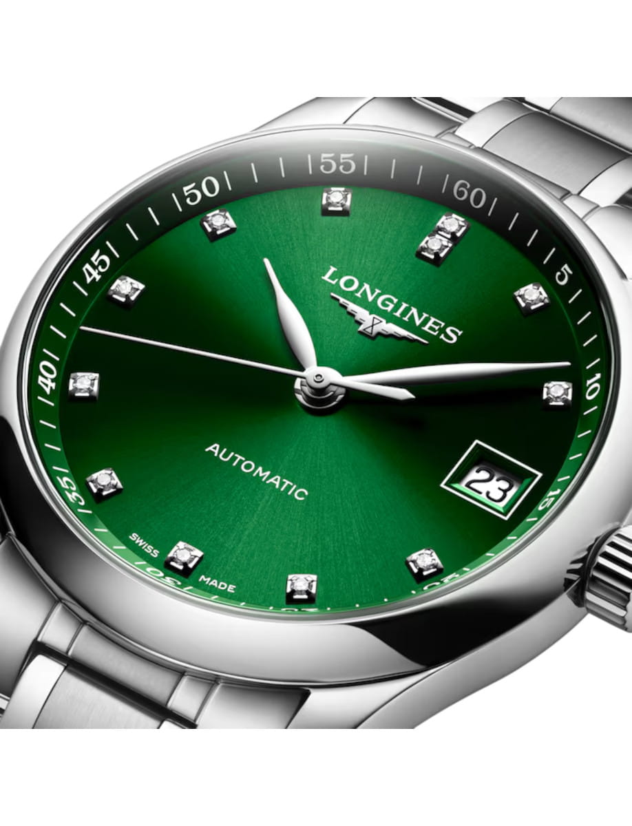 Longines automatic wristwatch with a green dial, diamond hour markers, and a date window at 3 o'clock