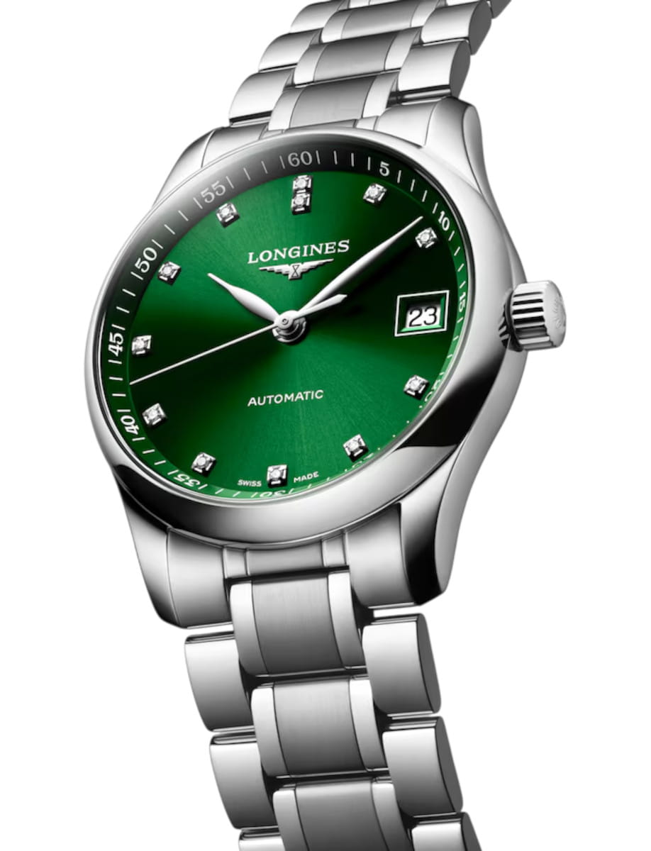 Longines automatic wristwatch with a green dial, diamond hour markers, and a stainless steel bracelet.