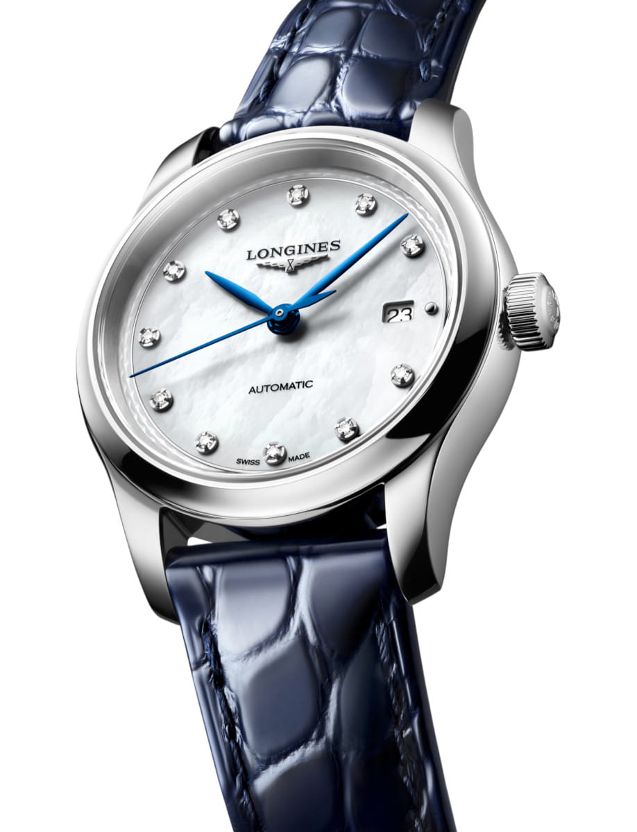 Longines automatic wristwatch with blue alligator strap, mother-of-pearl dial, diamond hour markers, and a date window at 3 o'clock.