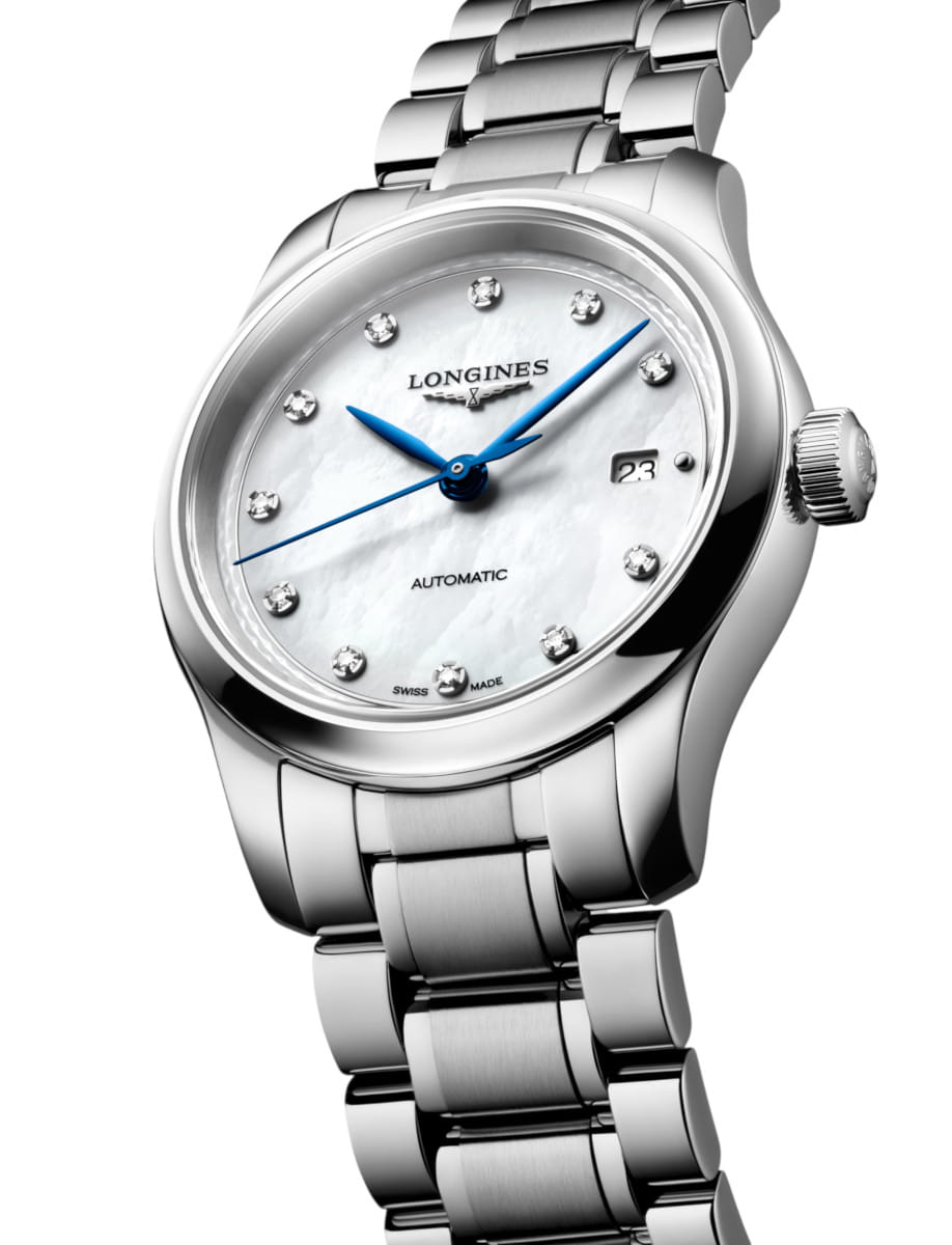 Stainless steel Longines wristwatch with a white mother-of-pearl dial, blue hands, diamond hour markers, and a date window.