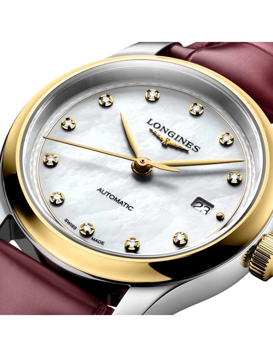 Longines wristwatch with a gold bezel, diamond markers, mother-of-pearl dial, and date window near 4 o'clock (automatic).