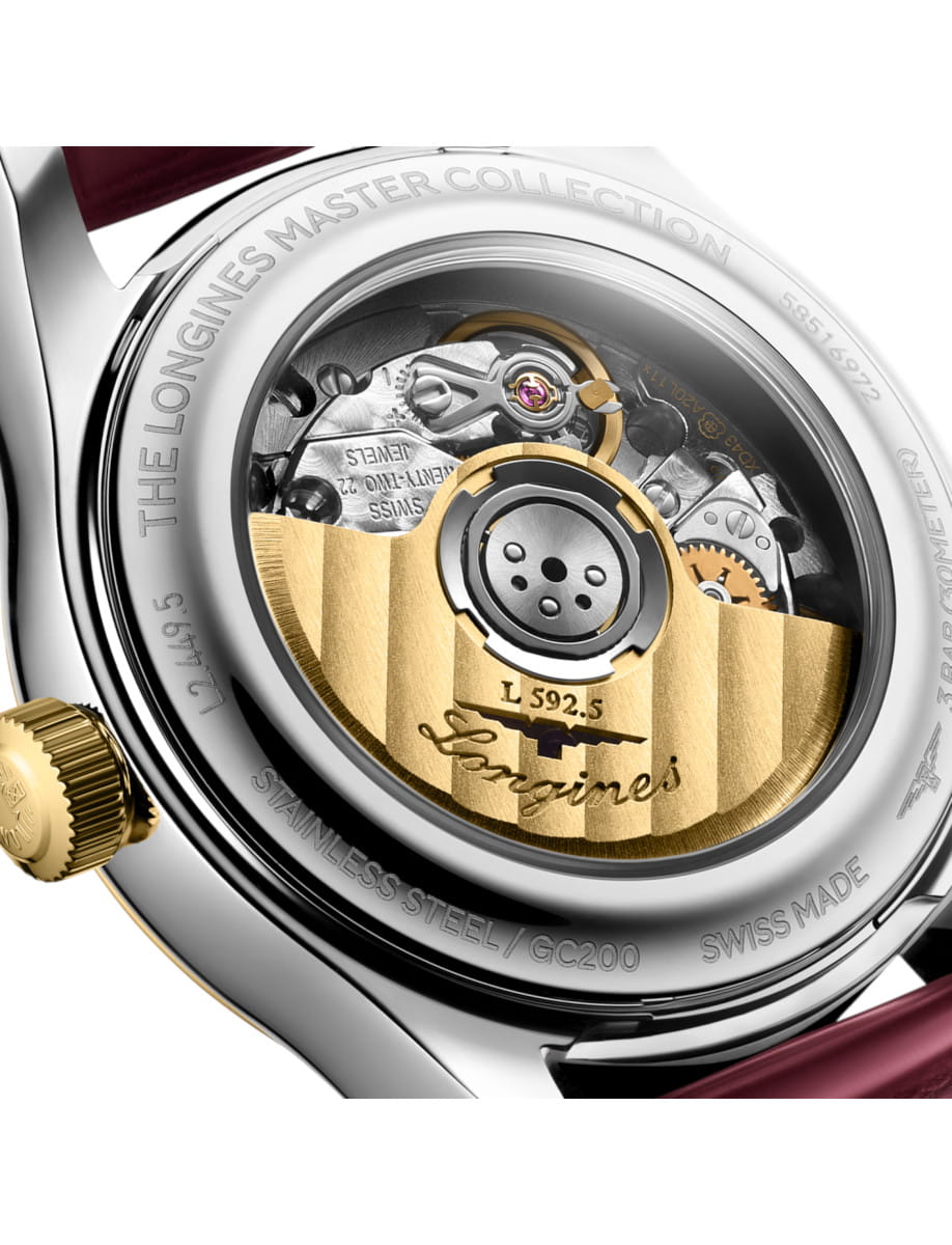 Close-up of a luxury watch movement visible through a transparent caseback, featuring a gold rotor and intricate gears, with 'Longines' engraving.