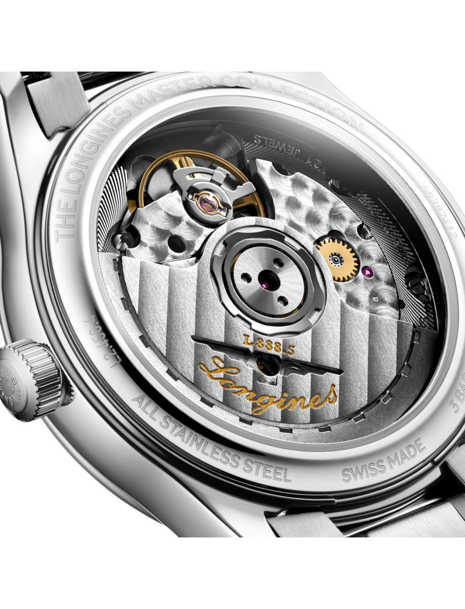 Back view of a stainless steel Longines watch showing its intricate mechanical movement with gold accents.