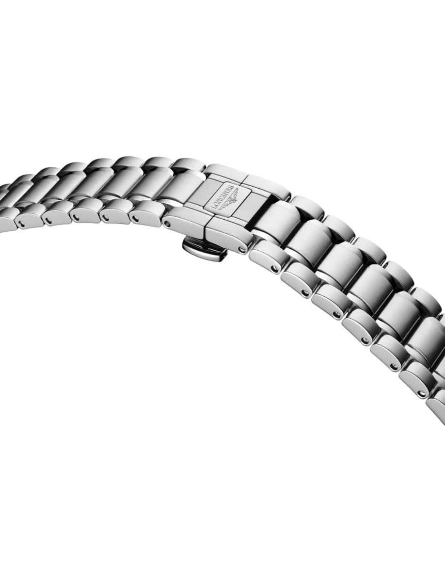 Close-up of a stainless steel watch bracelet with a deployment clasp on a white background