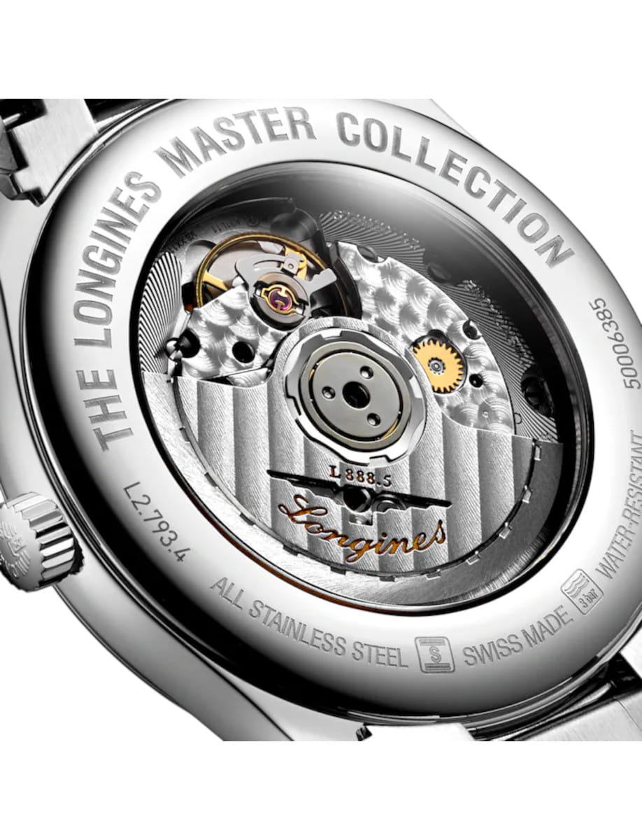 Close-up of a Longines wristwatch case back showing the mechanical movement and engravings.