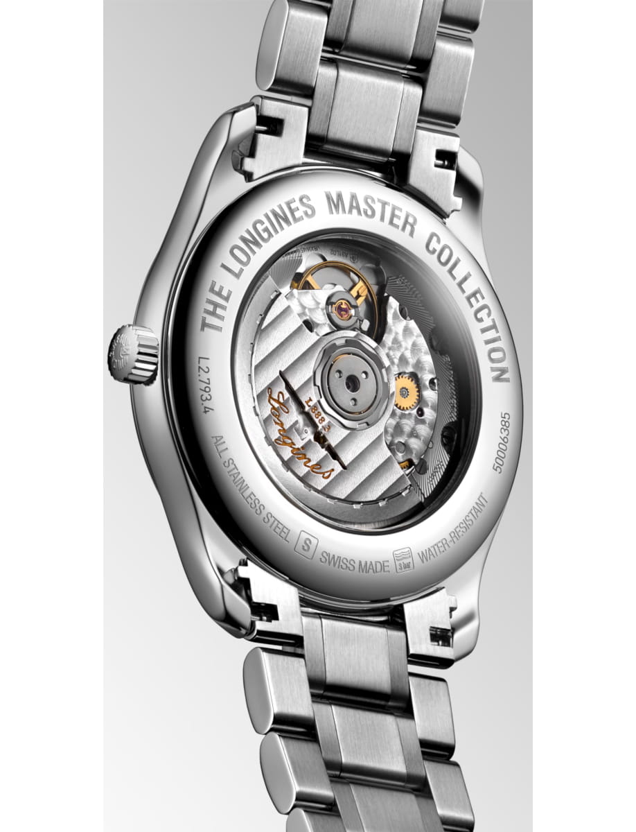 Close-up of the back of a stainless steel Longines Master Collection watch, showing the transparent case back and inner gears.