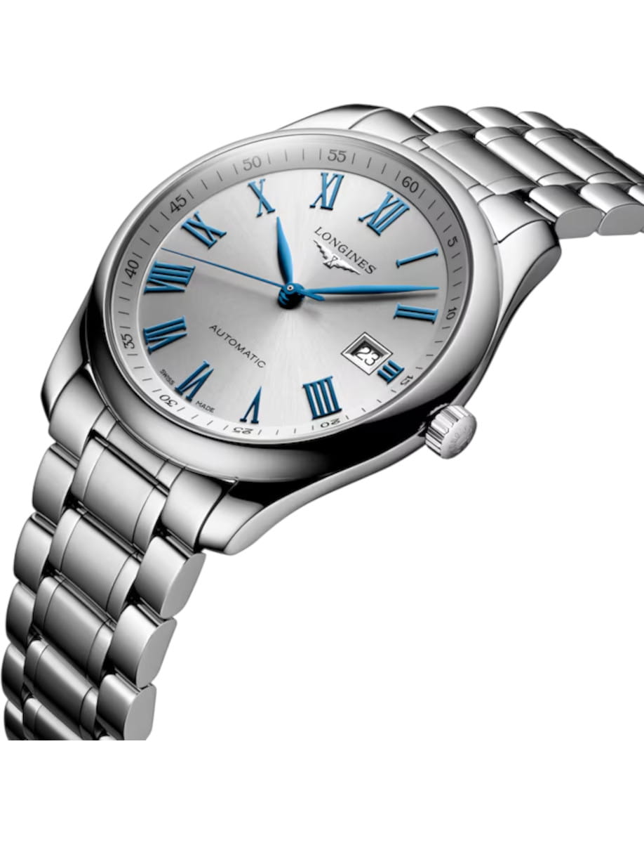 Silver wristwatch with blue Roman numeral markers, date window, and metal bracelet (Longines Automatic).