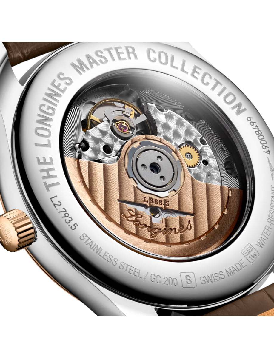 Close-up of a luxury watch movement visible through the caseback, with gold and silver gears and engraving 'Longines Master Collection'.