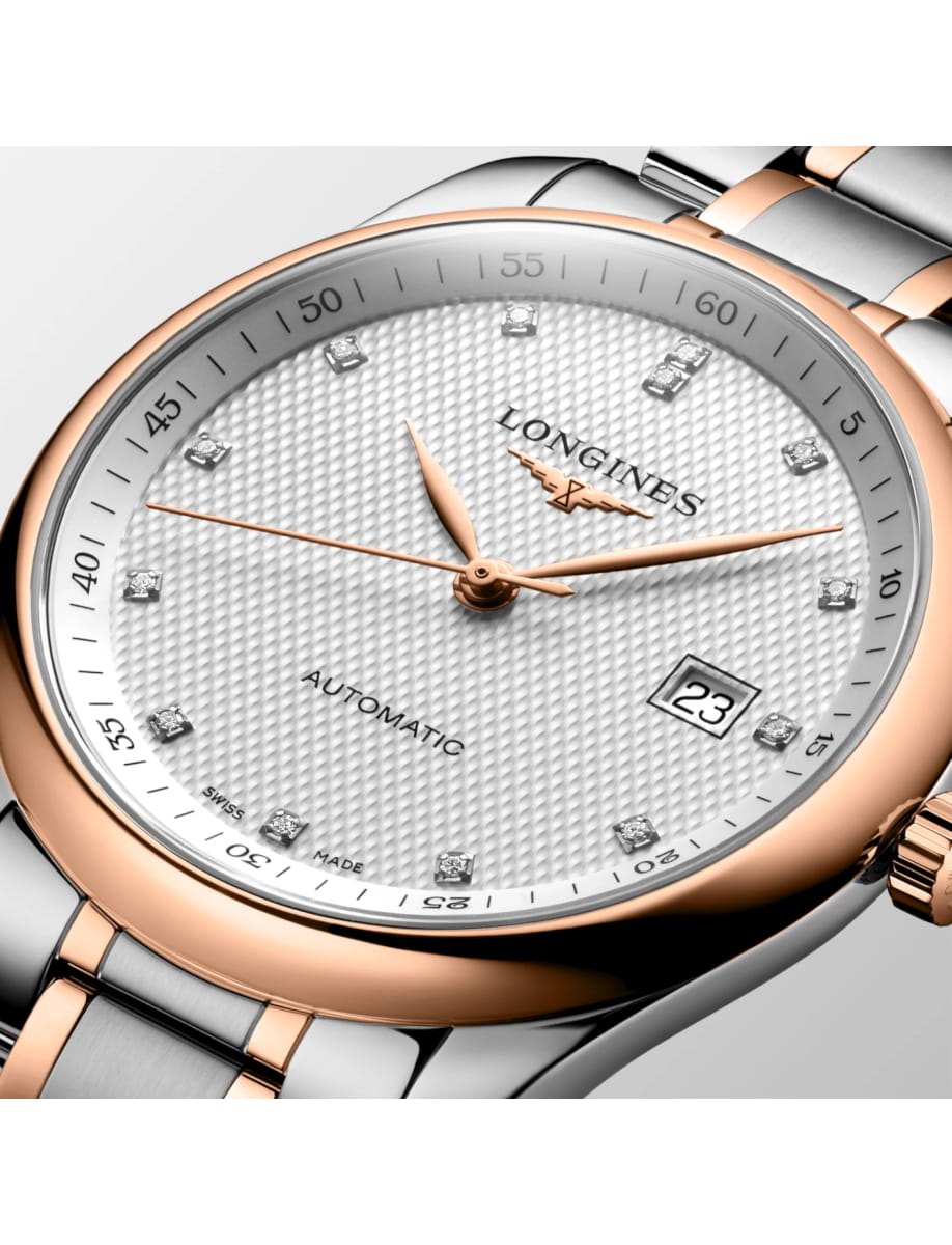 Two-tone Longines automatic wristwatch with diamond hour markers and date window on a textured white dial