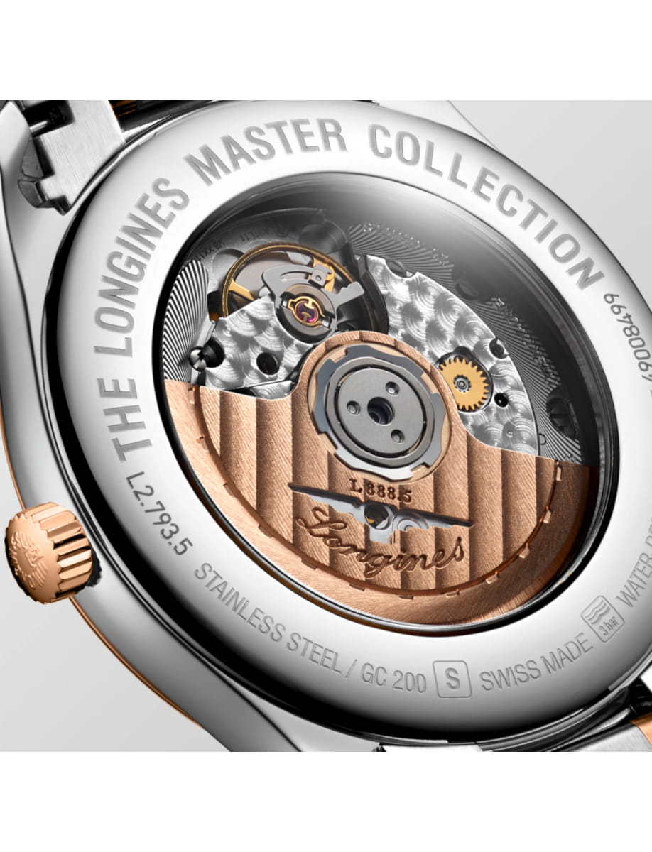 Back of a Longines watch showing the intricate mechanical movement through a transparent case back with engraved branding around the edge.
