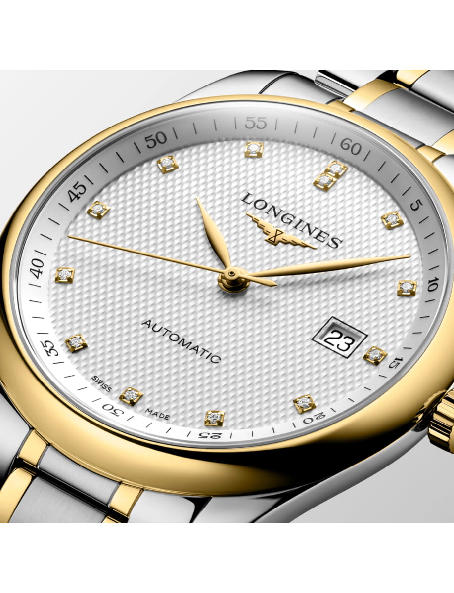 Two-tone gold and silver Longines automatic wristwatch with diamond markers and date window at 3 o'clock.