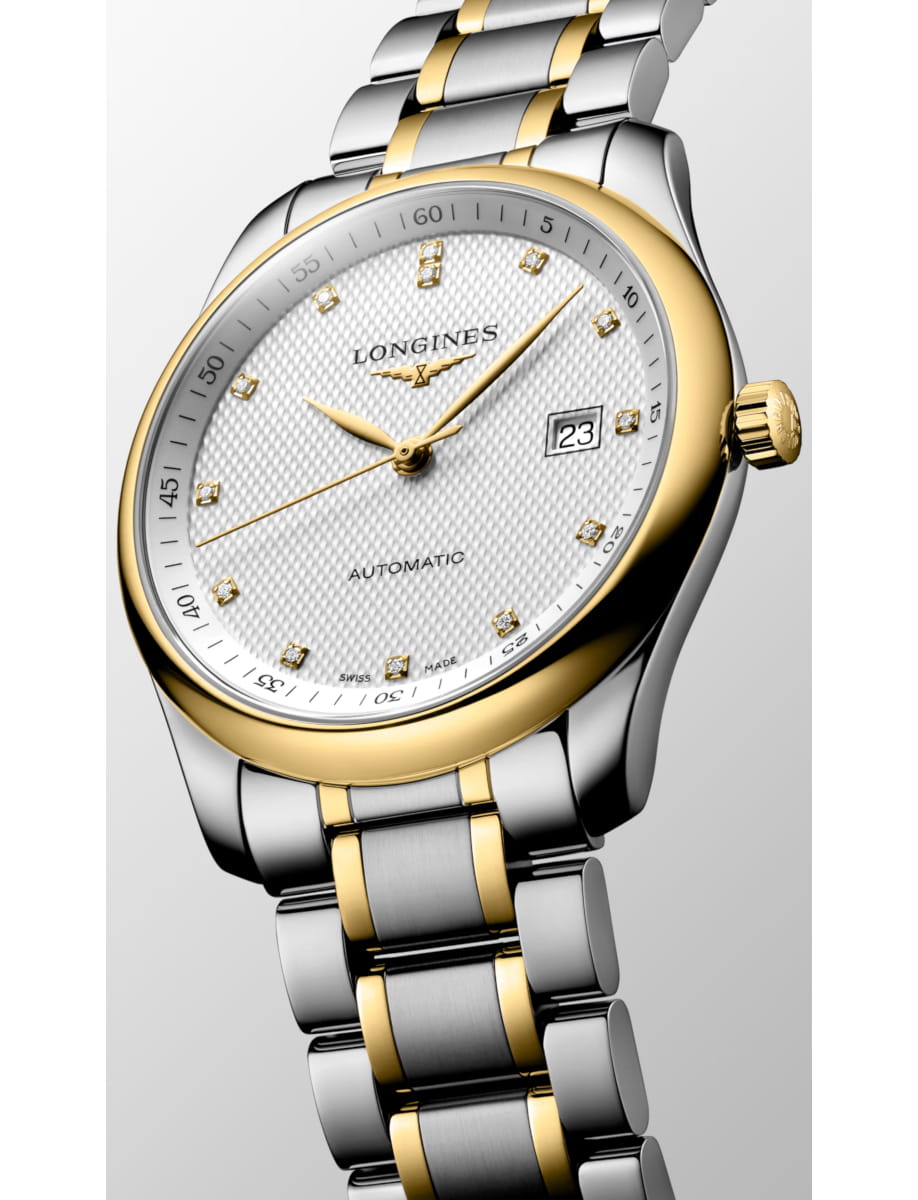 Two-tone gold and silver Longines wristwatch with a white patterned dial and date window at 3 o'clock, linked bracelet segments alternating gold and silver.