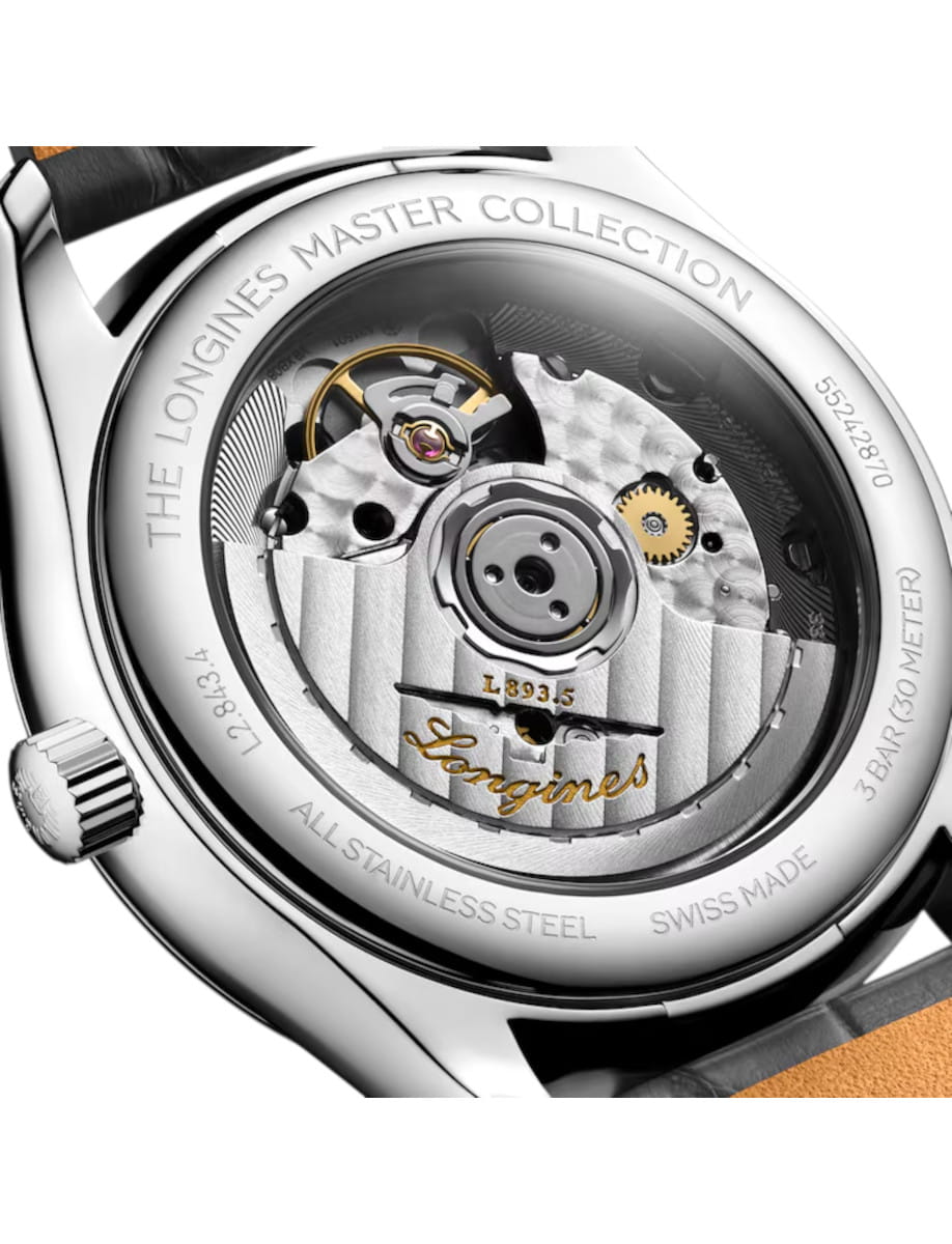 Open caseback of a stainless steel Longines Master Collection watch showing the mechanical movement and rotor.