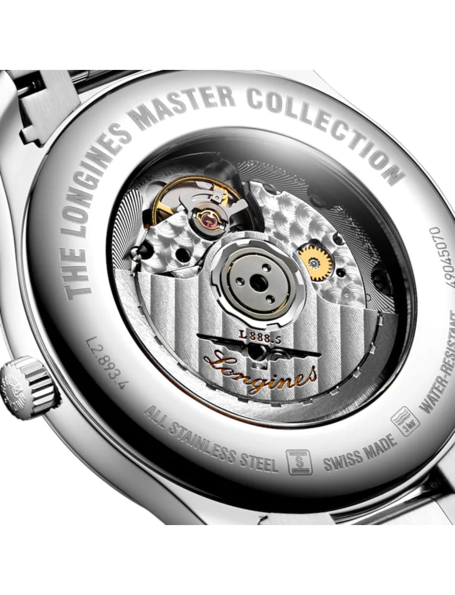 Close-up of a Longines Master Collection case back, showing the intricate mechanical movement through the transparent back with engraved branding and stainless steel finish.