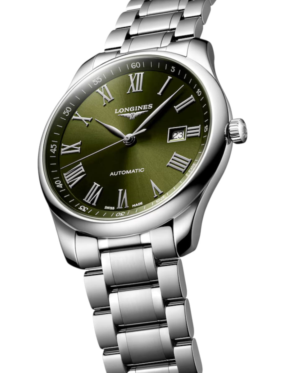 Longines automatic wristwatch with a green dial, Roman numerals, and a date window at 3 o'clock on a stainless steel bracelet