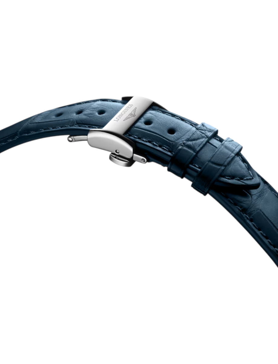 Blue leather watch strap with a silver deployment clasp (Longines) on a white background.