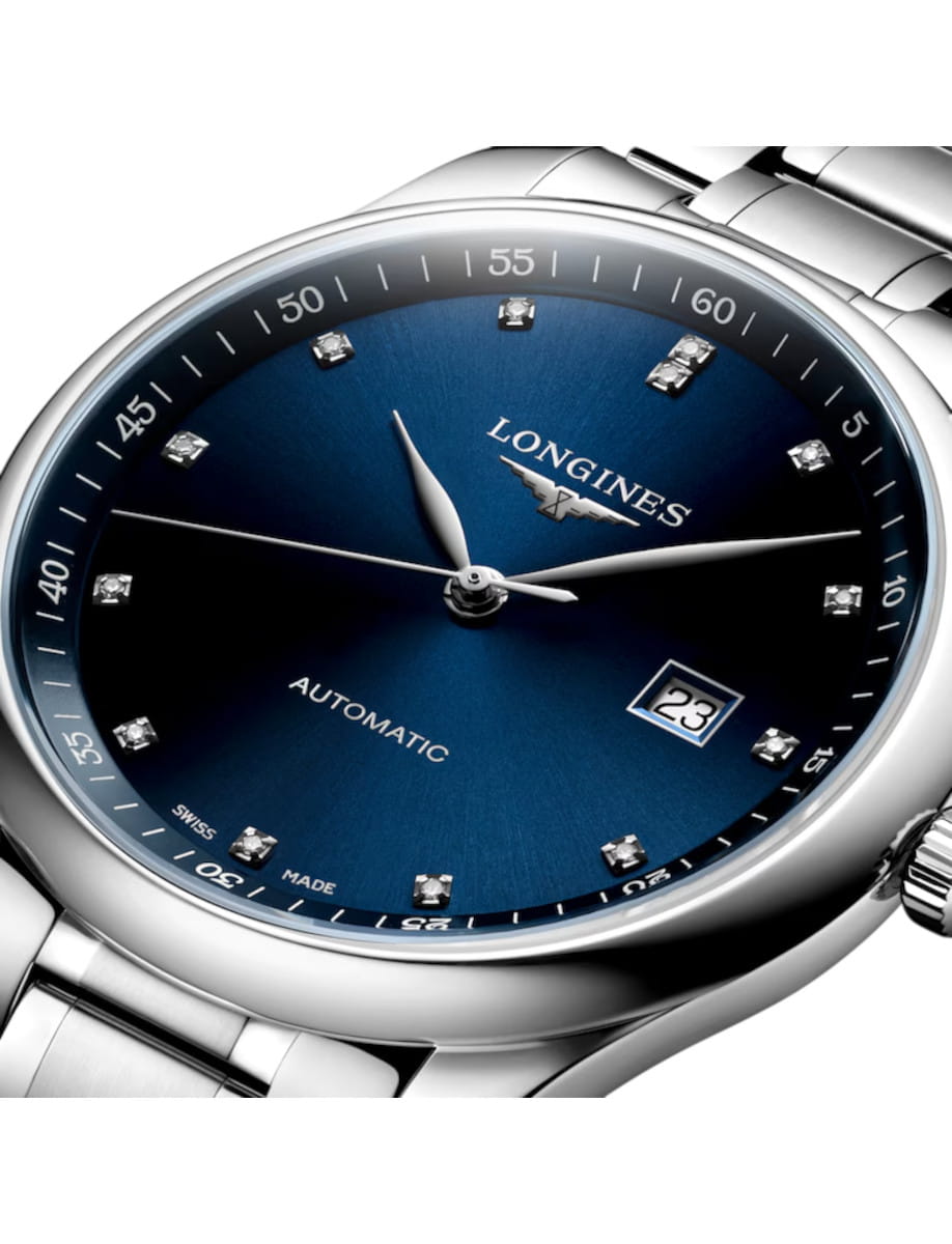 Longines automatic wristwatch with a blue sunburst dial, diamond hour markers, and a date window at 3 o'clock.