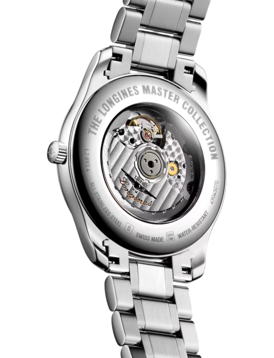 Back view of a Longines stainless steel watch with an exposed mechanical movement visible through a transparent case back, engraving reads 'The Longines Master Collection'.
