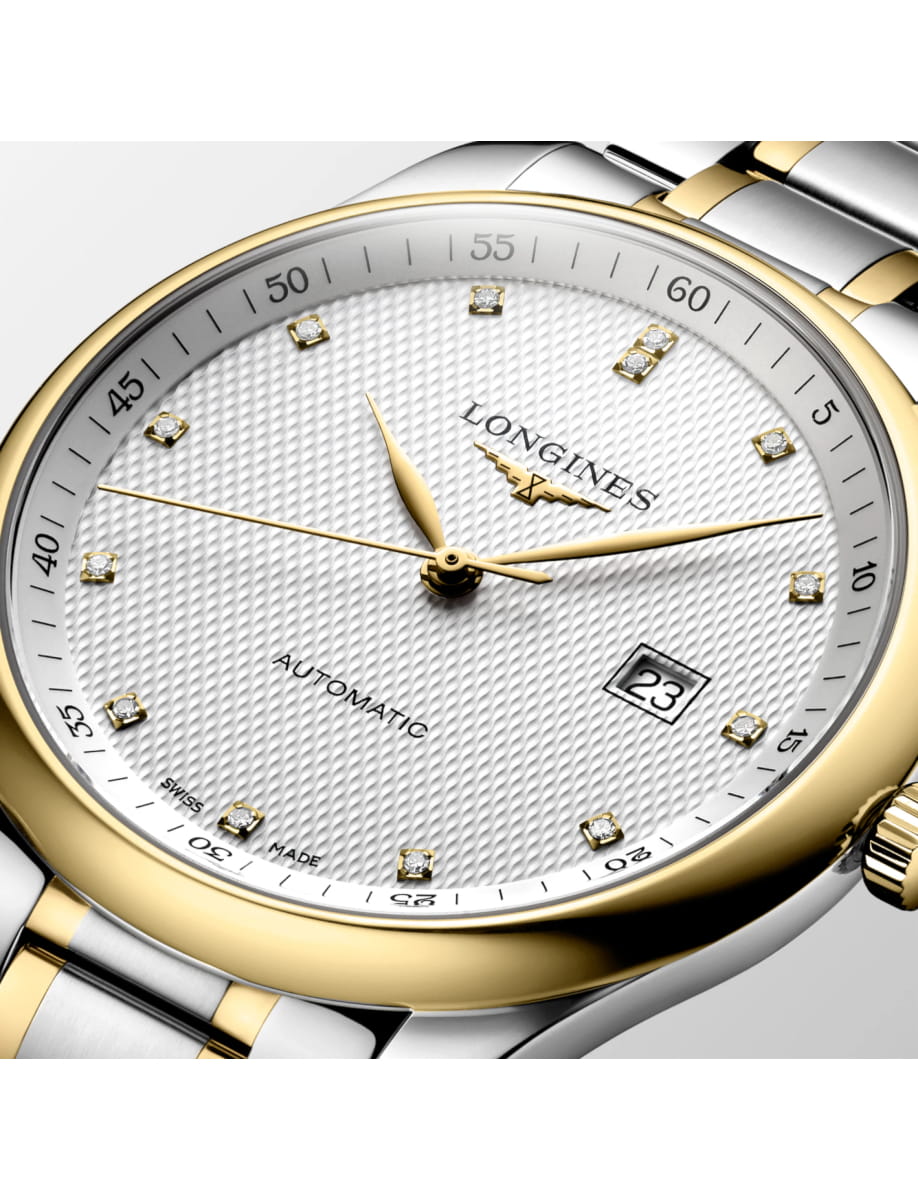 Close view of Longines wristwatch with stainless steel and 18k yellow gold case and bracelet