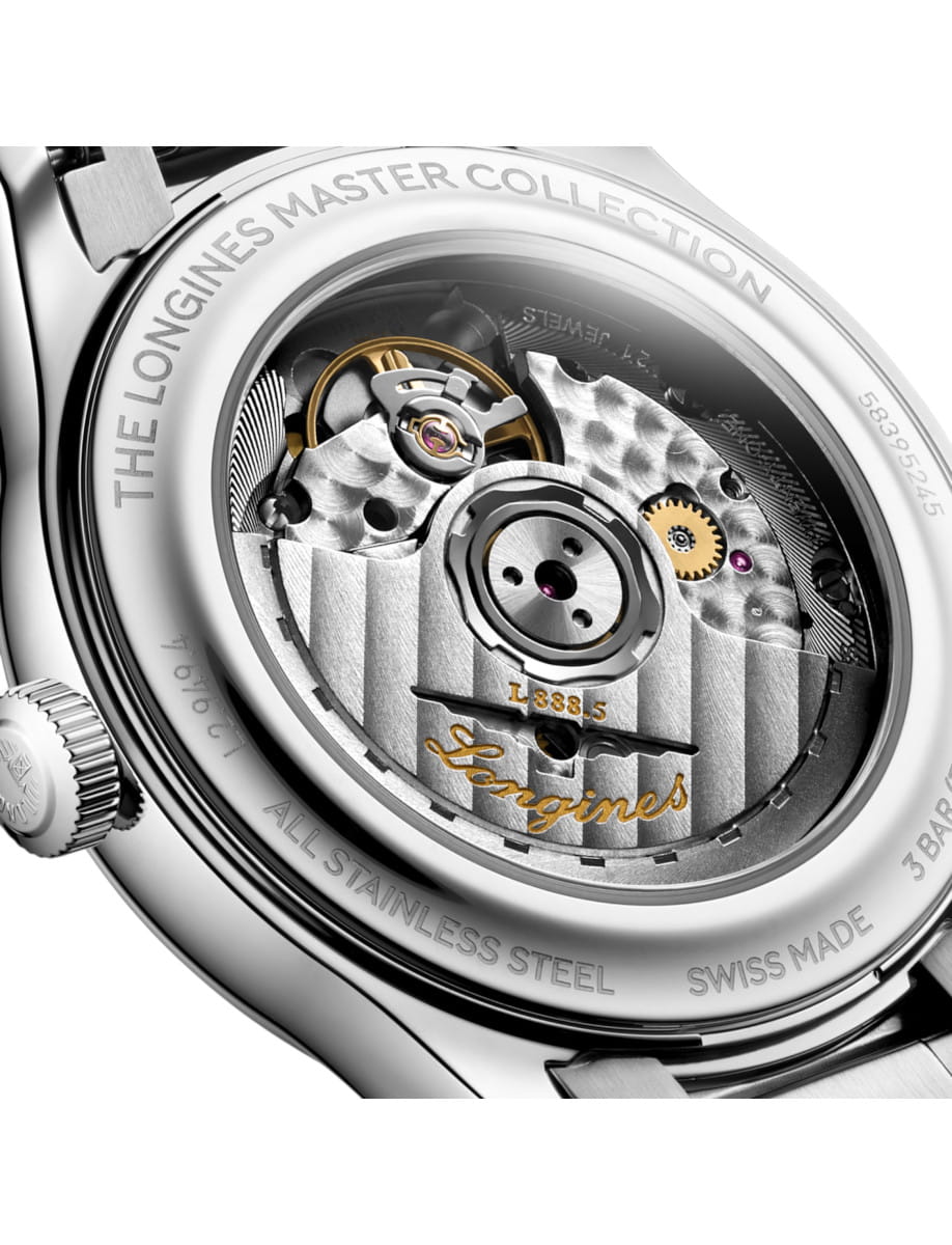 Close-up of a stainless steel watch case back revealing the intricate mechanical movement and gears inside.