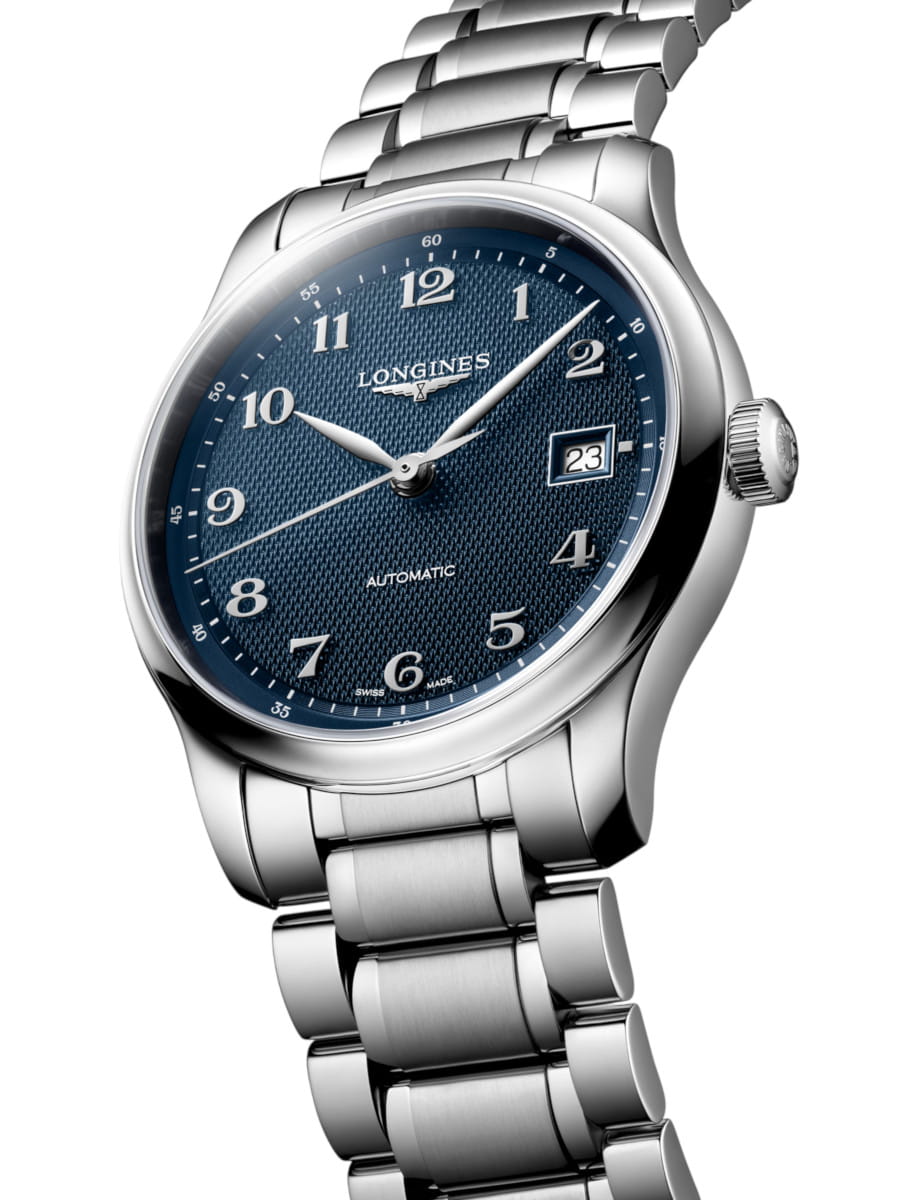 Longines automatic wristwatch with a blue textured dial, stainless steel case and bracelet, and a date window at 3 o'clock.