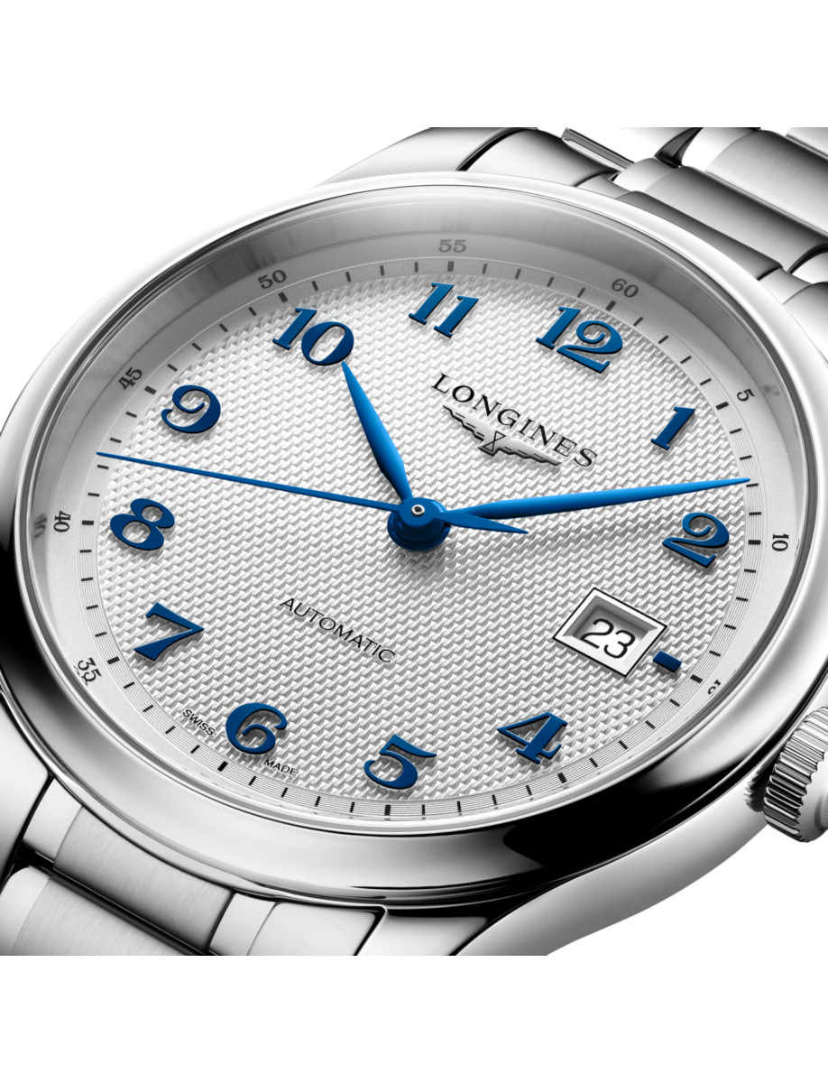 Close up image of Longines wristwatch with stainless steel case and bracelet, and silver 