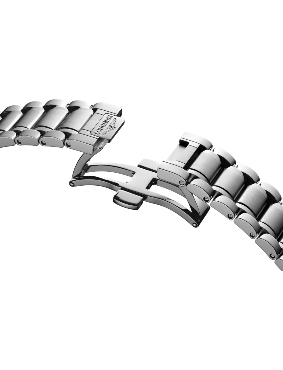 Close-up of a stainless steel watch bracelet with a deployant clasp.