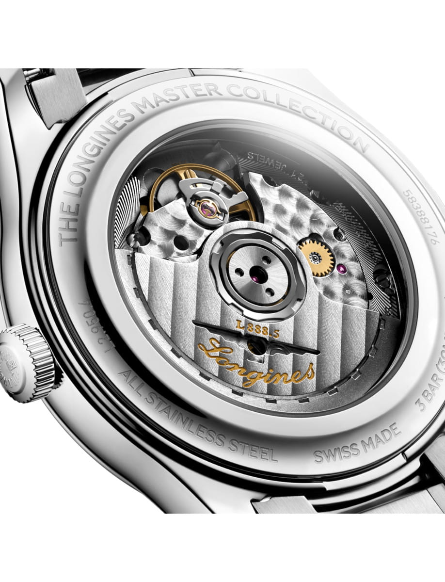 Close-up of a Longines stainless steel wristwatch case back, exposing the intricate mechanical movement with gears and rotor .