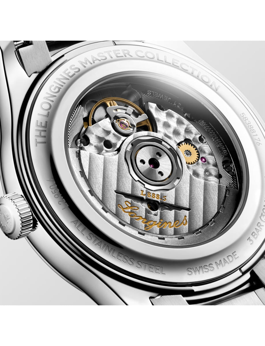 Close-up of a stainless steel watch case back revealing the automatic movement, with Longines engraving and sapphire crystal.