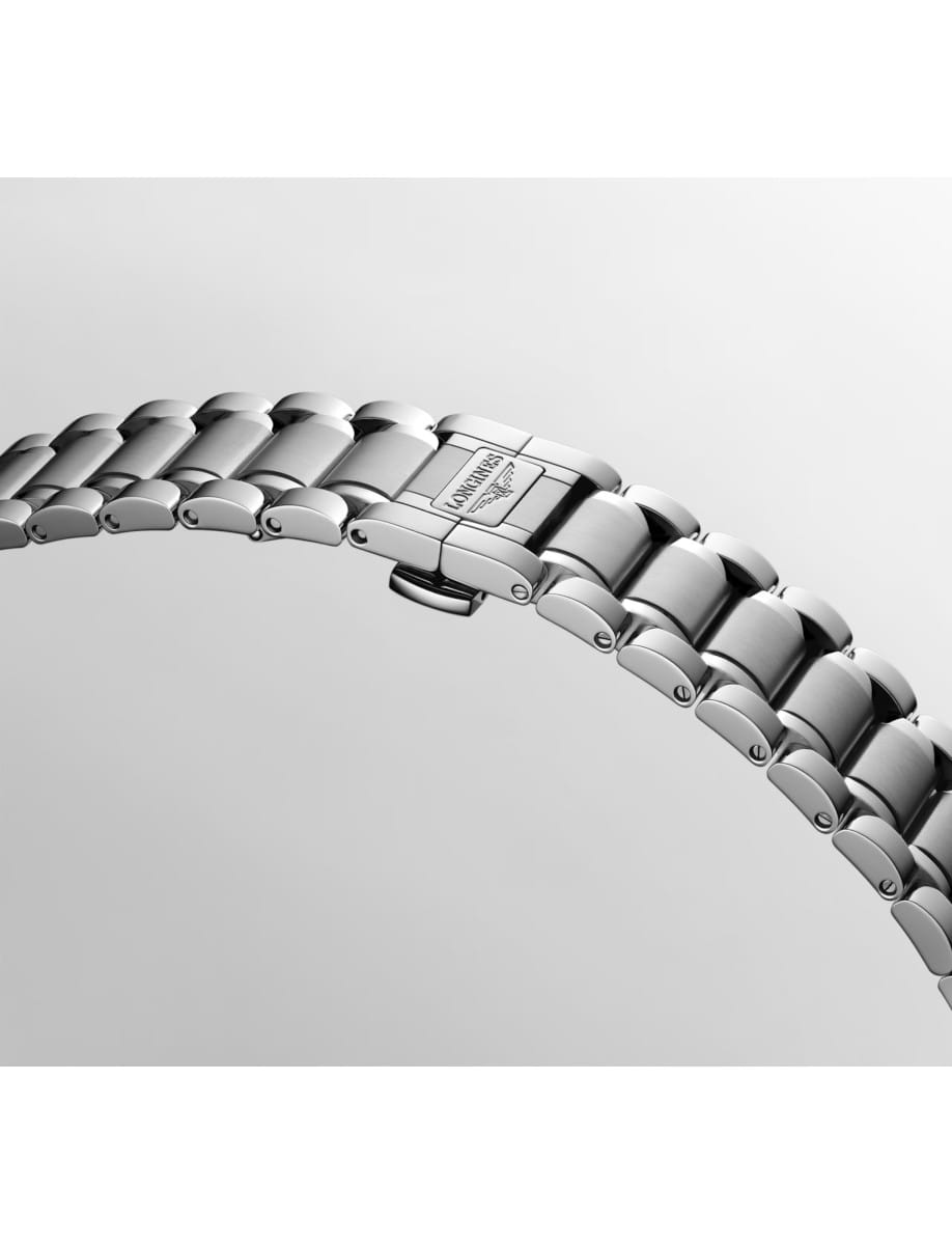 Close-up of a stainless steel metal watch band with a clasp showing the Longines logo.