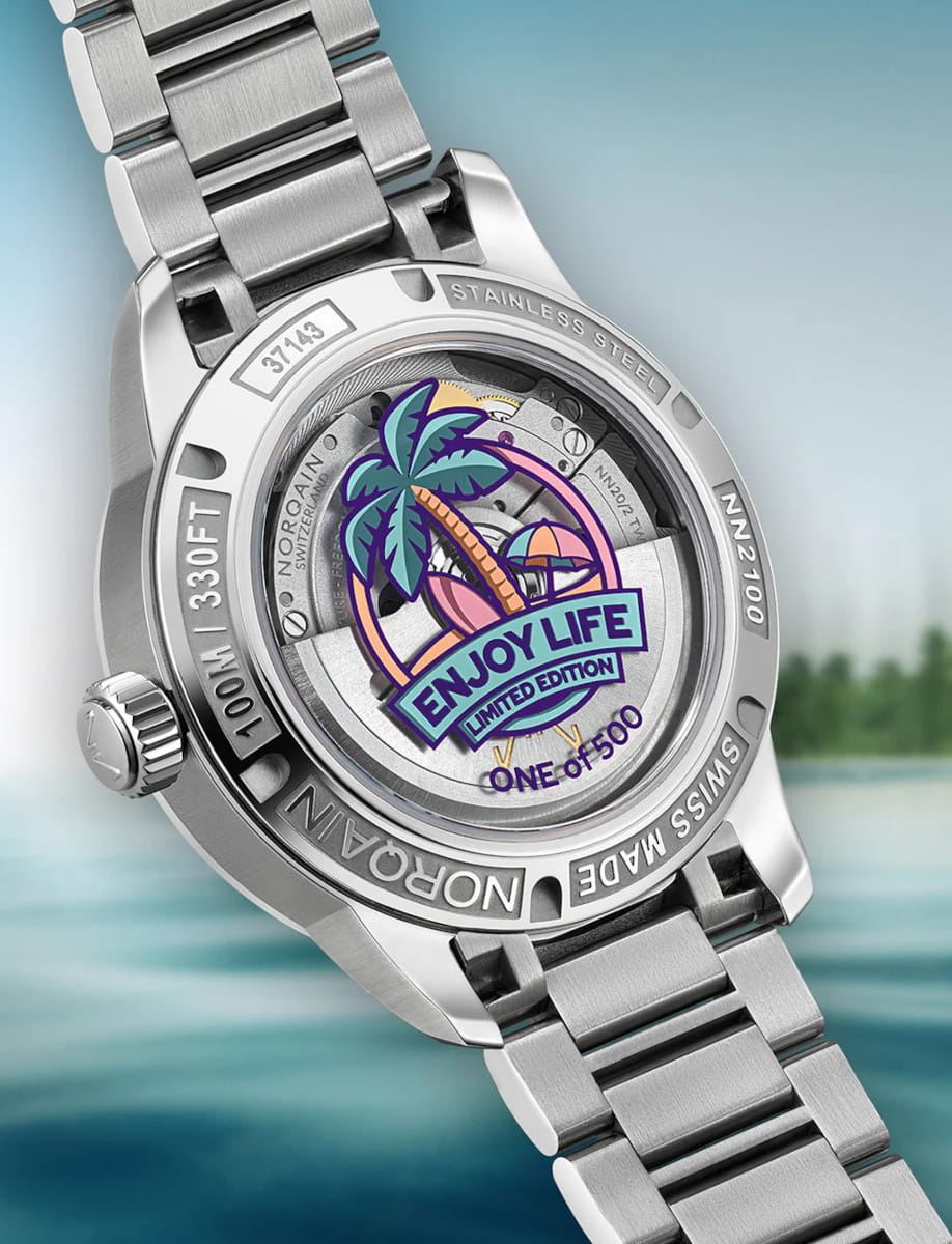 Norqin stainless steel watch back with a tropical sticker reading 'Enjoy Life Limited Edition — One of 500'.