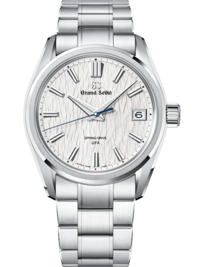 Stainless steel Grand Seiko wristwatch with textured white dial, date at 3 o'clock, and metal bracelet