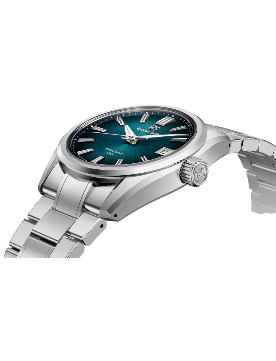 Side view of Grand Seiko wristwatch with Ever brilliant steel case and bracelet, and blue-green dial.