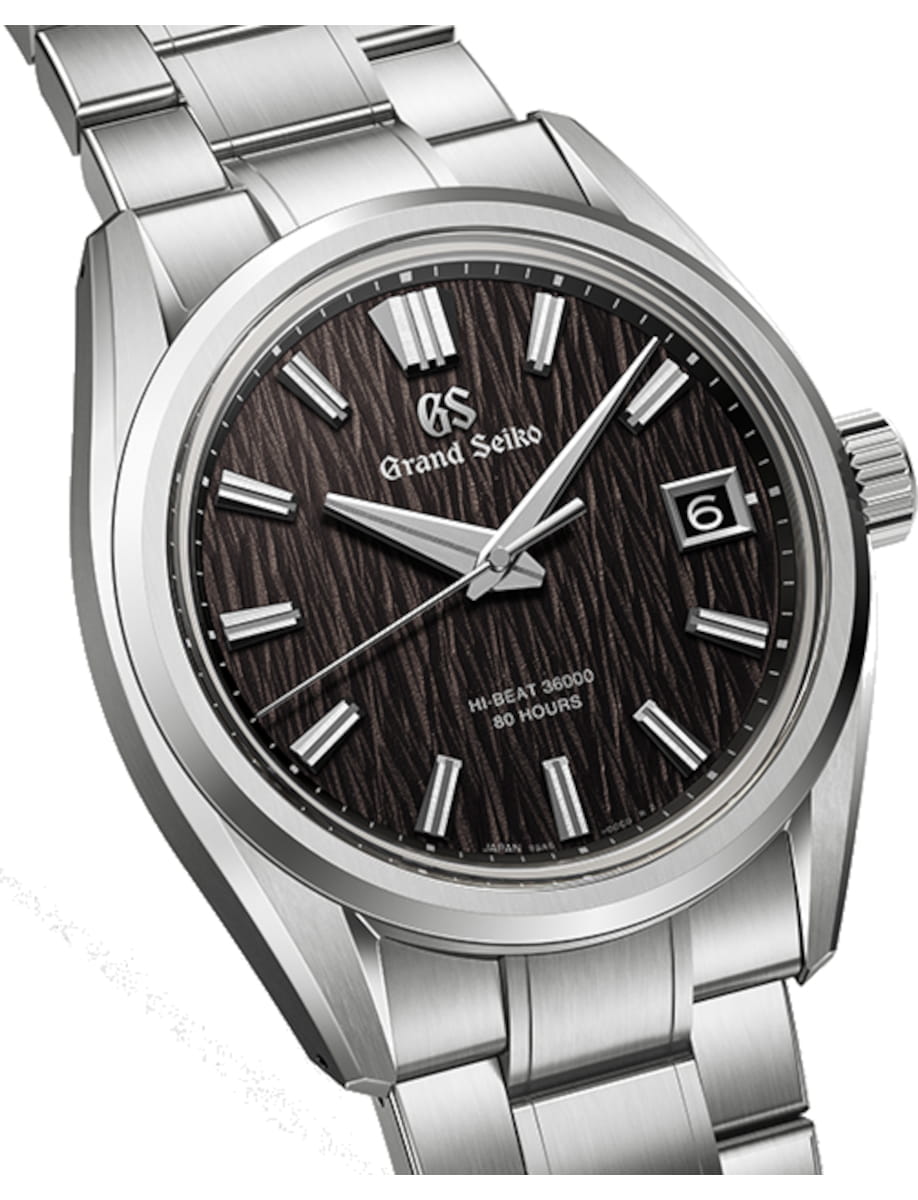 Front side view of Grand Seiko Evolution 9 wristwatch with high-intensity titanium case and bracelet, and deep black dial.