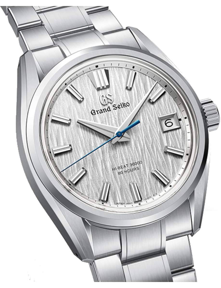 Side view of Grand Seiko wristwatch with Ever brilliant steel case and bracelet, and silvery-white dial.
