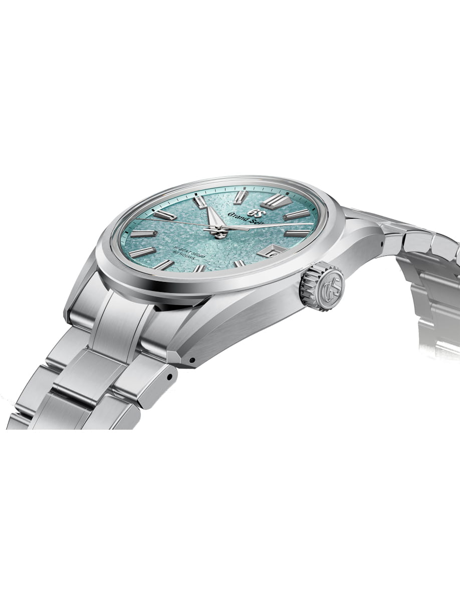 Side view of Grand Seiko wristwatch with Ever brilliant steel case and bracelet, and light blue dial.