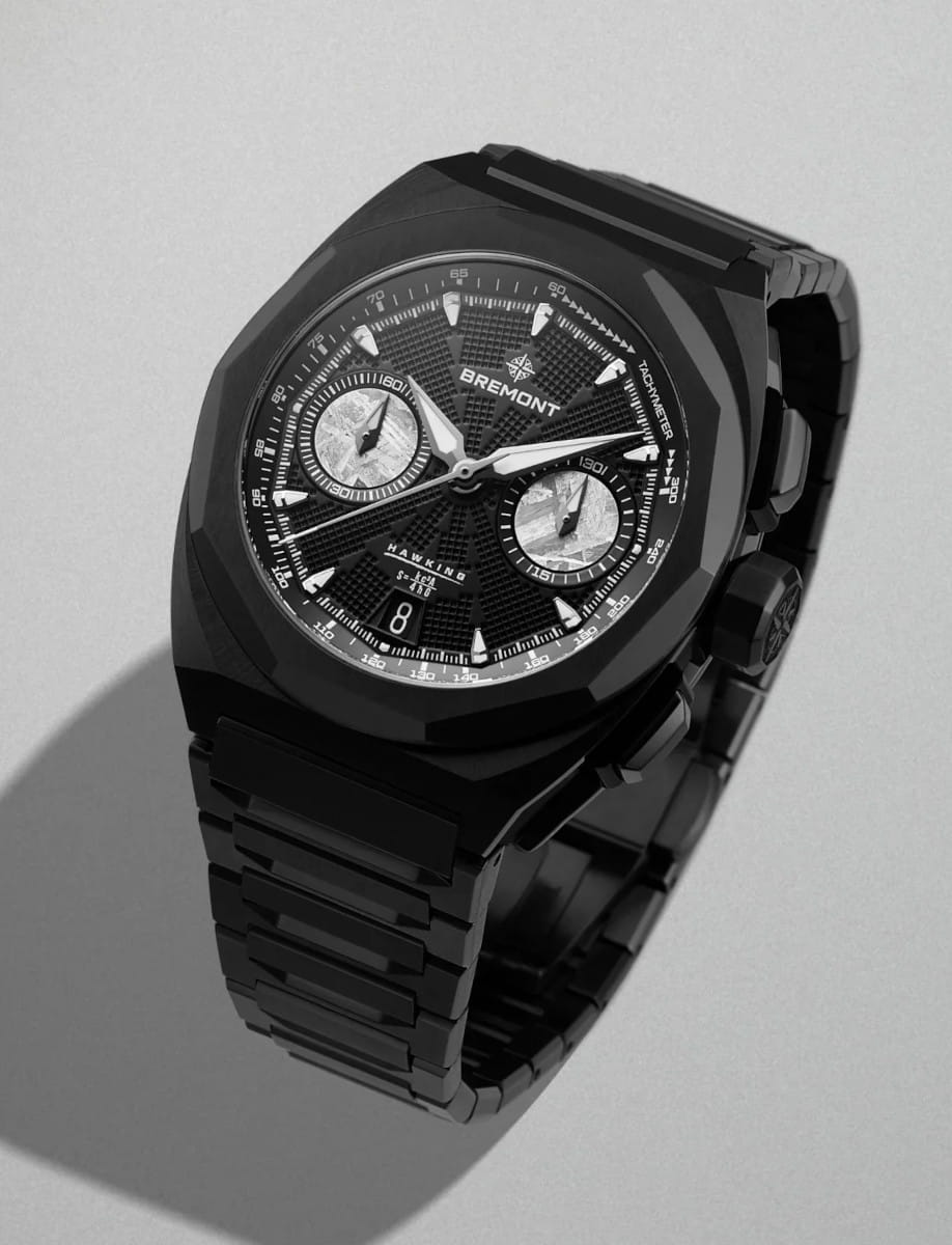 Black Bremont Hawk chronograph watch with a textured dial, three subdials, and a black metal bracelet.