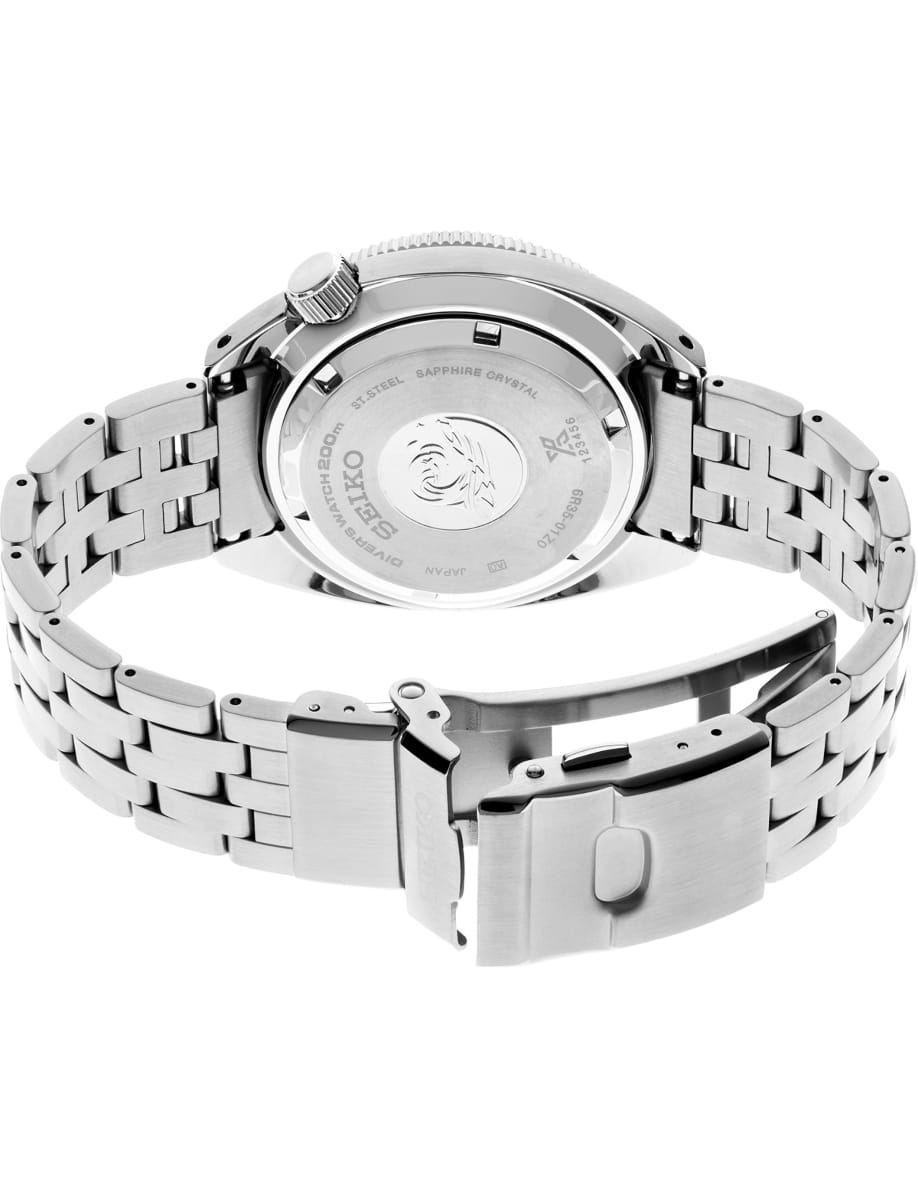 Back view of a stainless steel wristwatch with a metal link bracelet and deployment clasp, showing the case back details.